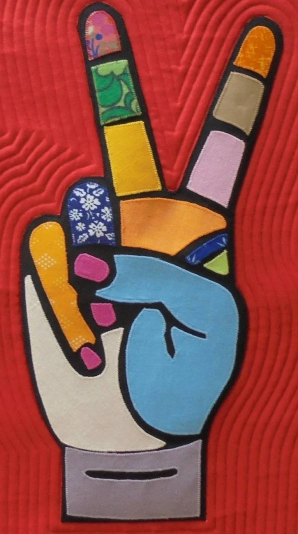 pop art style sign of peace with two fingers raised from a clenched fist