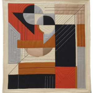 An abstract art quilt featuring a composition of geometric shapes in shades of orange, black, gray, and beige.